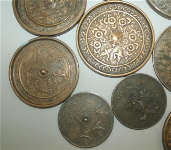 A large collection of Japanese bronze hand mirrors, 19th century, 7.6cm